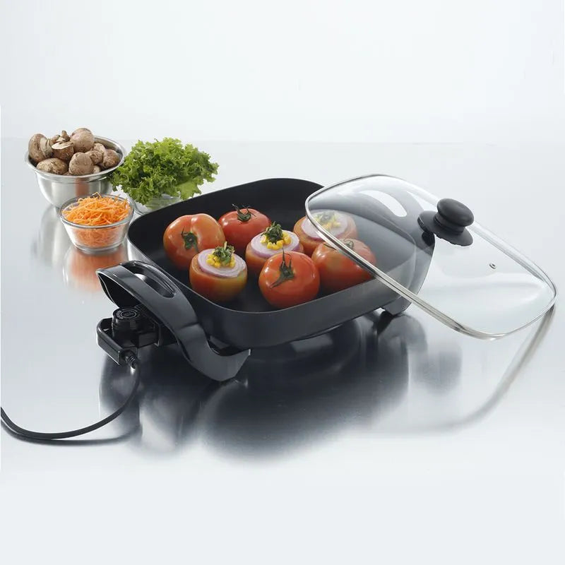 Sartén eléctrico de 30 cm con tapa de vidrio termo resistente y control de temperatura ajustable, ideal para cocinar con versatilidad y facilidad.
