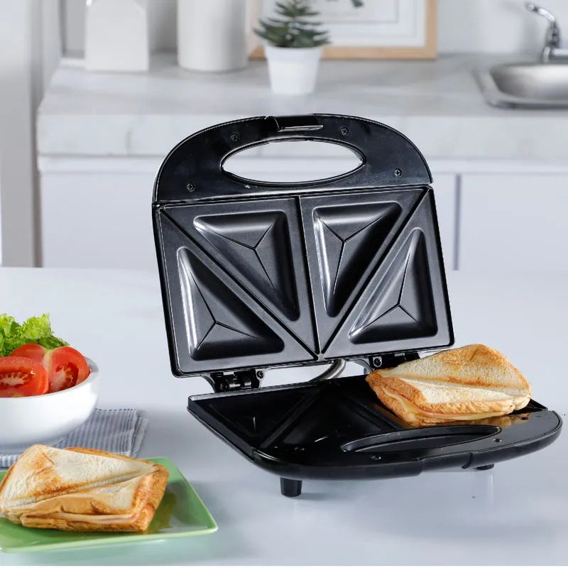 Sanduchera IMUSA Basic con diseño compacto, mango frío al tacto y luces indicadoras.