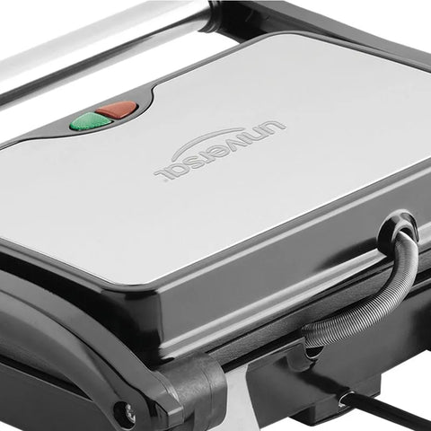 Sanduchera Universal Panini Grill con placas antiadherentes, cierre seguro, indicadores luminosos y diseño de acero inoxidable.