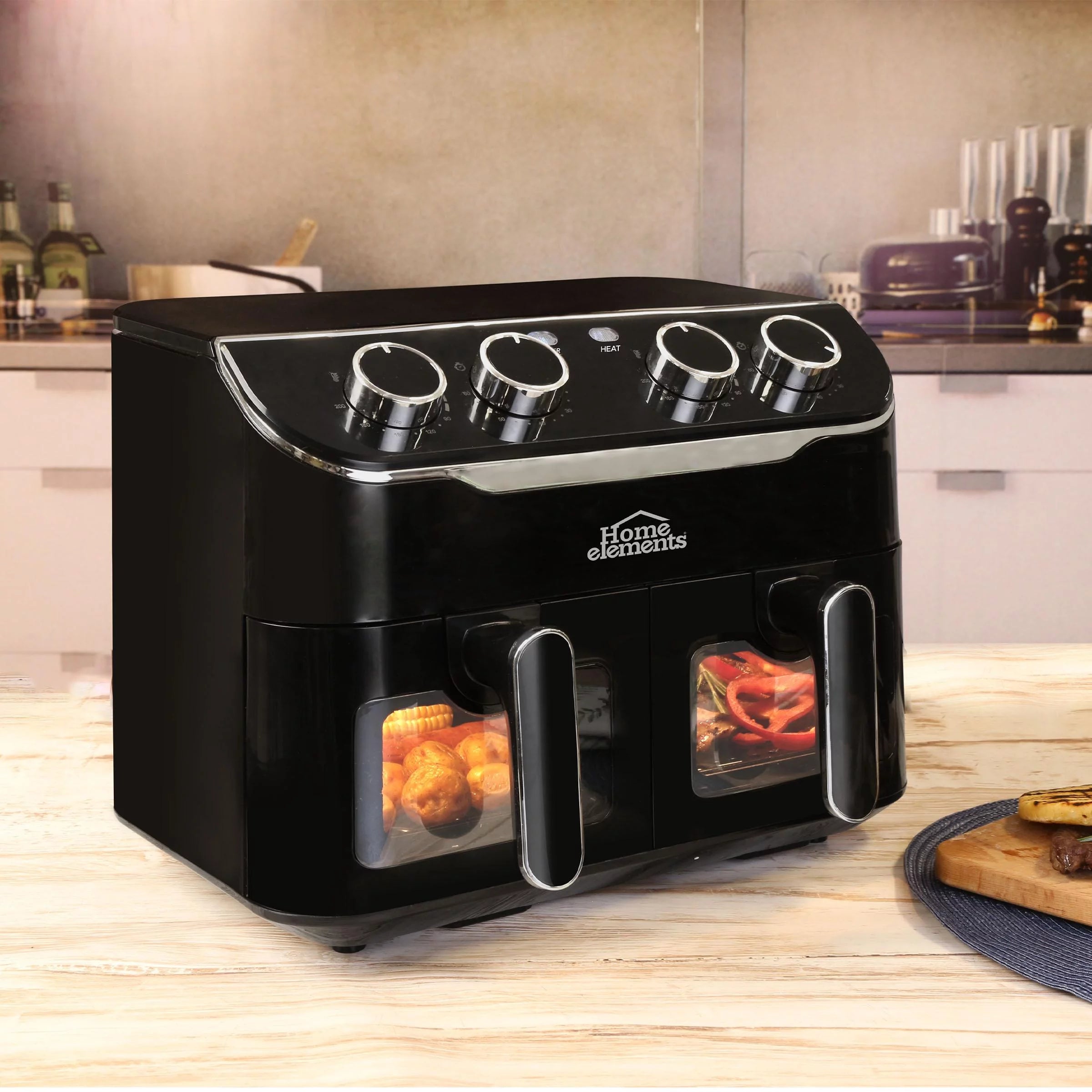 Freidora de Aire Home Elements de 8 litros con doble canastilla, luz interna, control de temperatura independiente y diseño antiadherente para preparaciones saludables.