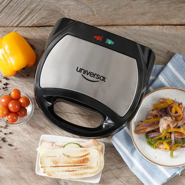 Sanduchera Universal Grill con diseño de sonrisa, placas antiadherentes, cubierta de baquelita y indicadores luminosos.